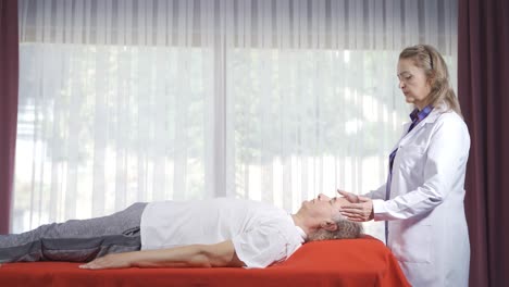 Patient in therapy. Bioenergy therapy.