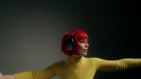 woman with headphones and red hair