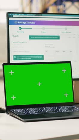 vertical video fulfillment center male staff verifying parcel status with green screen