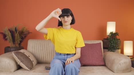 Woman-looking-at-camera-with-a-negative-expression.