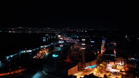 aerial night view of new mosque. there says " be responsible, be happy"