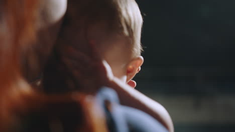 mother holding baby