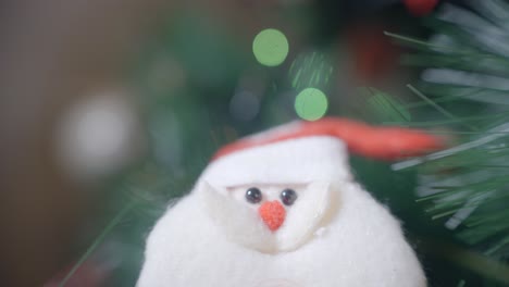 close-up of a santa claus ornament on a christmas tree