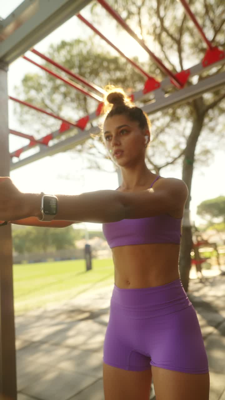 Young Woman Engaged in Outdoor Fitness Training with Resistance Band