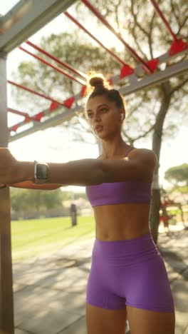 young woman engaged in outdoor fitness training with resistance band