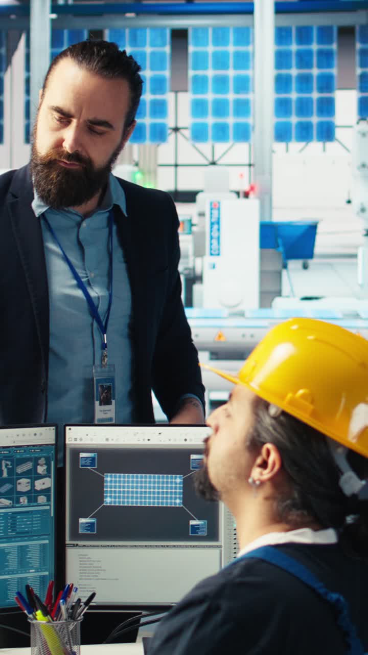 Vertical Video Manager Instructs Solar Panels Plant Employee On How To Use Cad Software