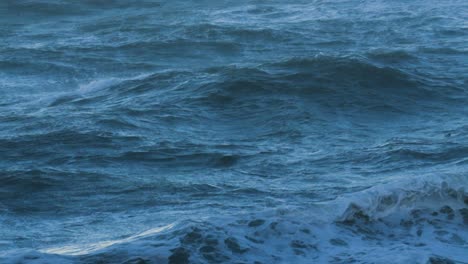 calming mesmerizing soothing rough stormy sea waves in ultra slow motion during high winds storm weather. powerful turbulent swell in british bay 4k.