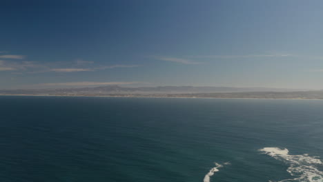 4K-smooth-cinematic-high-altitude-pan-of-Monterey-Bay-with-the-cities-of-Sea-Side,-Monterey-and-Pacific-grove-visible-on-a-beautiful-day