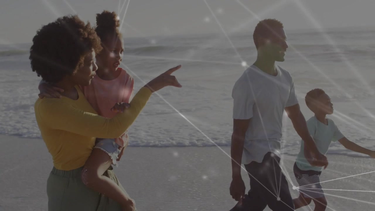 Family walking sand man pointing leading woman holding kid raising arm boy turning to tech nodes