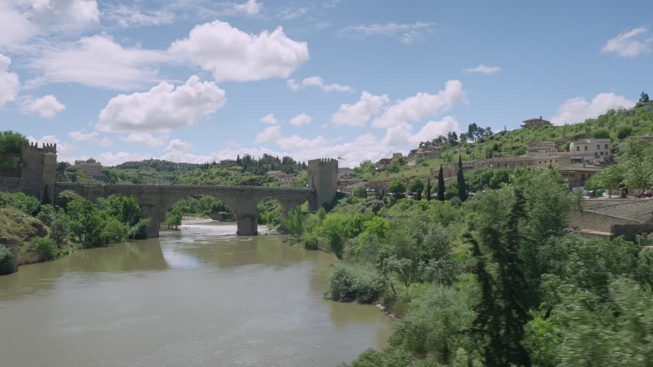 MOVING SHOT POV FROM A BUS OF TOLEDO CITY RIVER AND BRIDGE