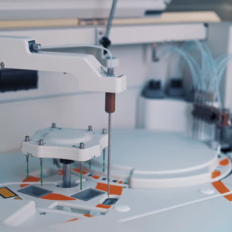 functional medical laboratory with biochemical analyzer in it. working process of automated machine in a laboratory. chemical and biological laboratory of examining blood.
