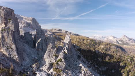 aerial truck left reveals beautiful cinque torri rock formations