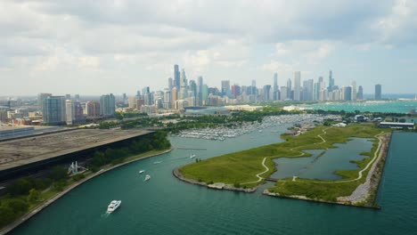 drone reveals northerly island with chicago skyline in background