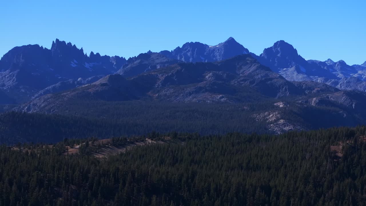 Minarets Vista California Sierras Banner Peak Volcanic Ridge Mammoth Mountain Lakes Yosemite NP aerial drone PCT Trail afternoon morning blue sky clouds nature landscape forward pan up motion