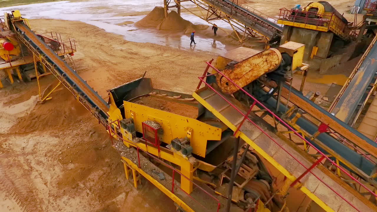 Sand moving on automatic conveyor belt. Mining conveyor sand sorting