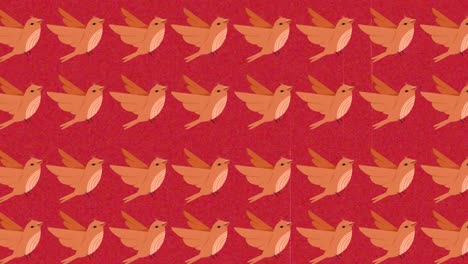 Animation-of-multiple-orange-birds-over-red-background