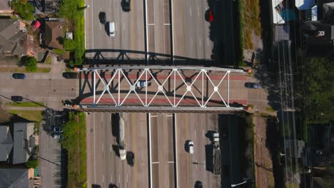 Aerial-of-cars-on-59-South-freeway-in-Houston,-Texas-on-a-bright-sunny-day