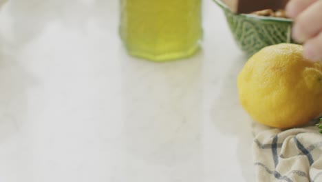 crop cook putting cheese and garlic on table