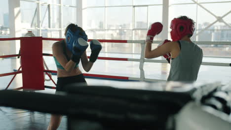 women boxing training in gym