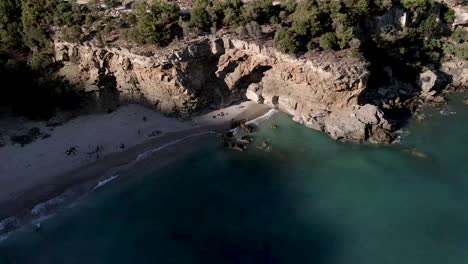 Tourists-On-Thassos-Greek-Islands-With-Rocky-Sea-Cliffs-In-North-Aegean-Sea,-Greece