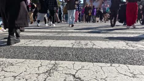 pedestrians crossing a busy urban intersection