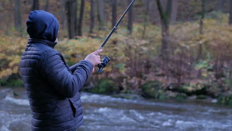 fishing in the river fisherman with a fishing rod on the river bank a man fisherman catches fish fishing in the river fisherman with a fishing rod on the river bank a man fisherman catches fish fishing spinning fish breg river the concept of rural recreation