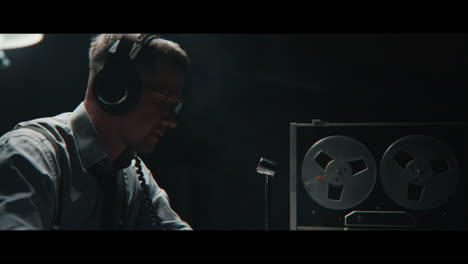 an intelligence officer listens to the wiretap recordings