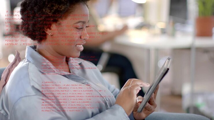 Woman tapping tablet in work lounge, scrolling, causing red overlay shifting, reviewing technology