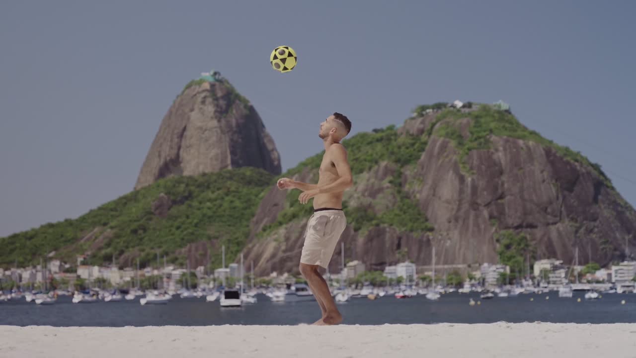 Man Juggling Soccer Ball on Rio de Janeiro Beach with Sugarloaf Mountain