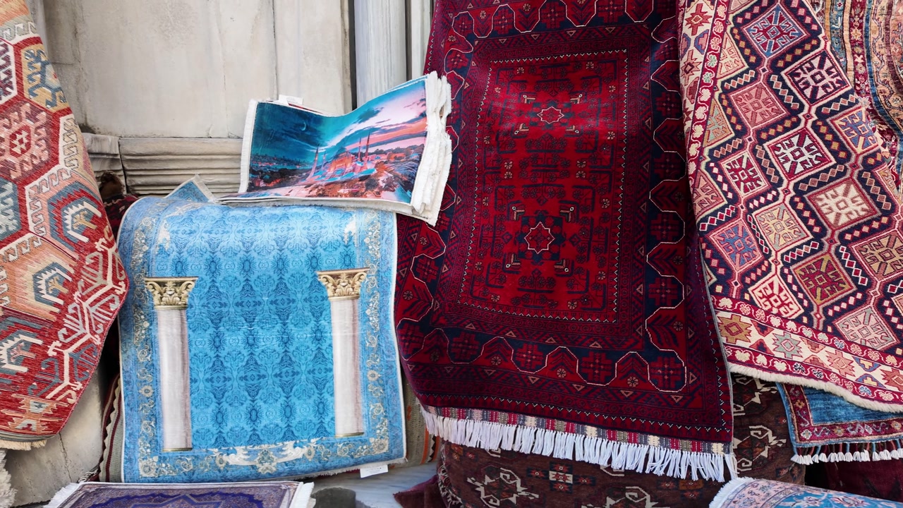 Colorful Traditional Turkish Carpets and Rugs Displayed in a Bazaar