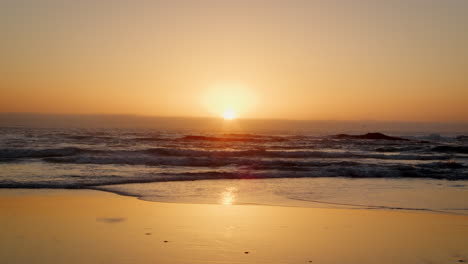 slow motion sequence of sunset over beach in south africa