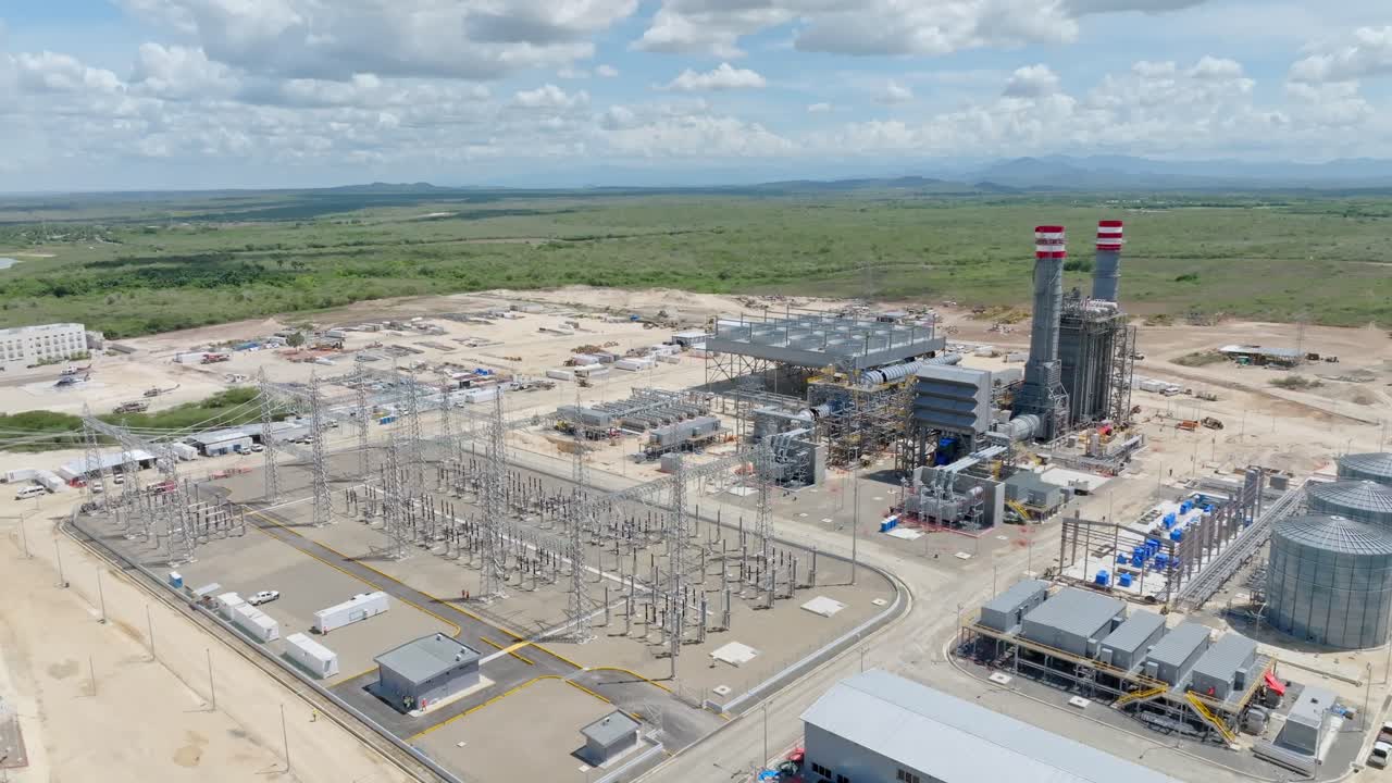 Aerial shot of Energy 2000 Energy Generation Plant in Manzanillo, Dominican Republic. Summer day with green landscape in rural area