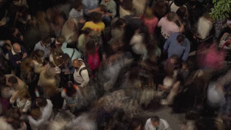 crowd of people on the street at night