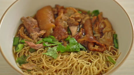 stewed pork leg noodles in brown soup