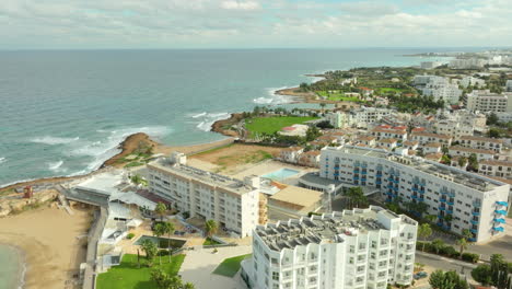 coastal charm of pernera with this aerial snapshot, sparkling mediterranean embraces luxury seaside resorts, offering a picturesque setting for the ultimate vacation experience