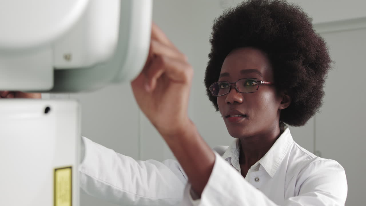 Portrait of professional doctor african ethnicity smiling at camera in the hospital female