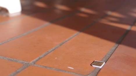 small object on a brick floor