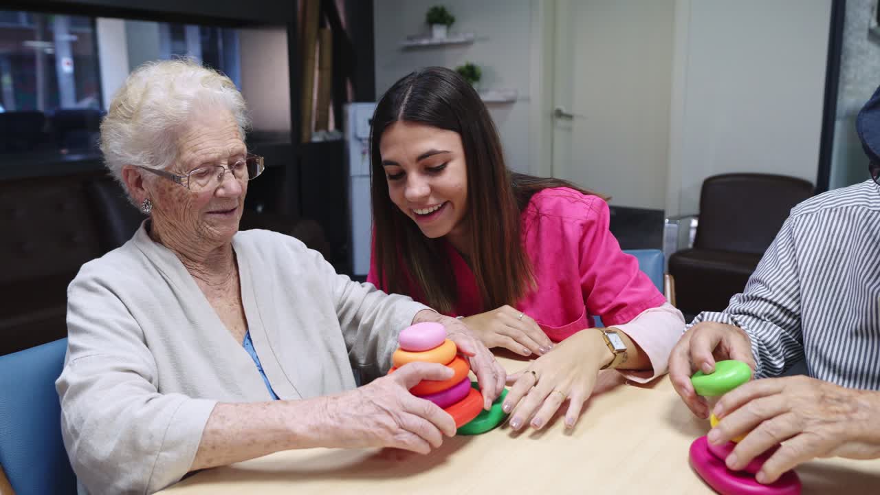 Group of people playing a stacking ring game