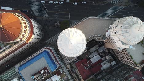 Aerial-view-as-we-approach-the-dome-of-a-building-diagonally-north-in-the-city-of-Buenos-Aires,-Argentina,-bathed-in-daylight