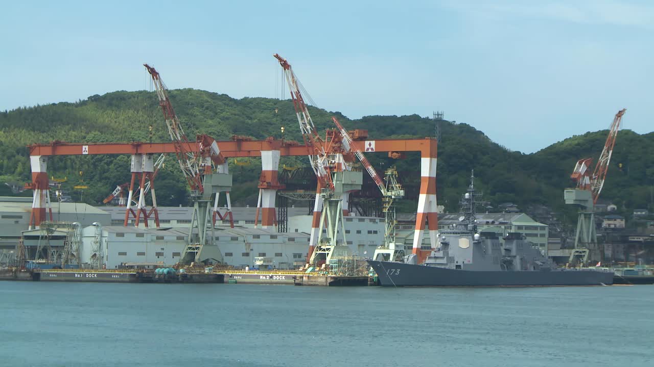 Military Ship Docking Next to the Cranes in Port of Nagasaki, Japan