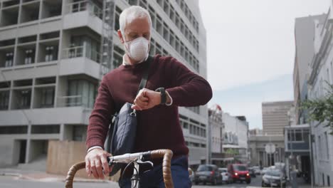 caucasian man out and about in the street wearing on a face mask against coronavirus