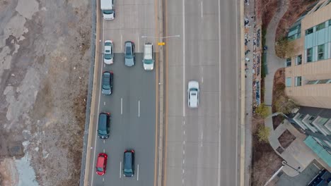 cars drive on the fdr in new york city, top down overhead with 4k drone, day