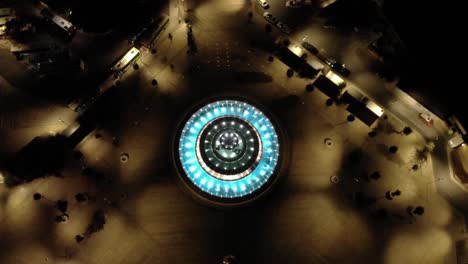 Aerial shot of a beautiful fountain icon during the night.