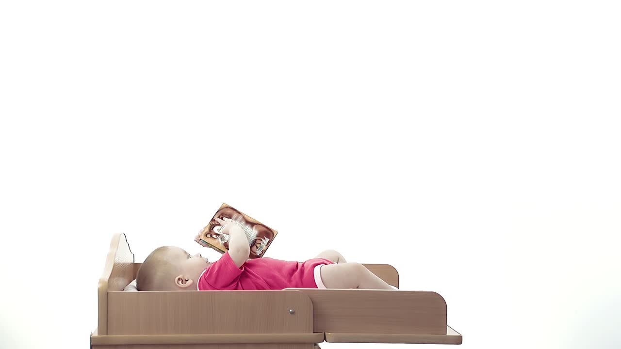 Adorable baby lying on a diaper table