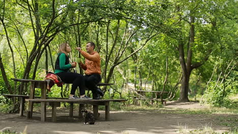 couple in nature drinking tea