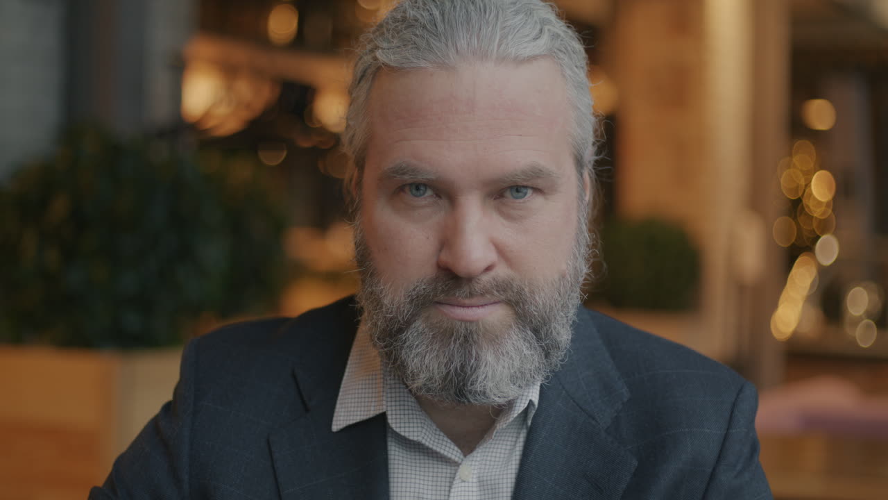 Portrait of a Serious Man in a Restaurant