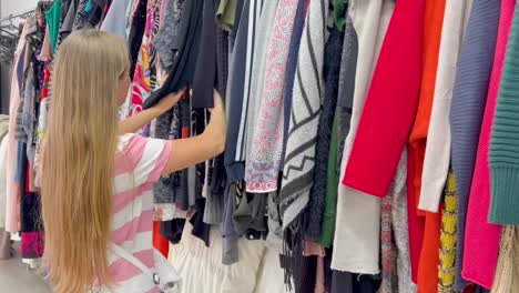used clothes on hangers in a store a big pile of old useless clothes fashion used clothes on hangers in a store a big pile of old useless clothes fashion second hand