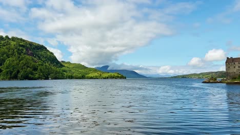 scenic landscape with eilean donan castle in scottish highlands - panning shot