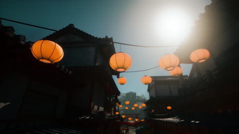 a view of a traditional japanese street lit by lanterns