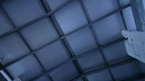 new metal roof with beams. low angle view. construction of a building.